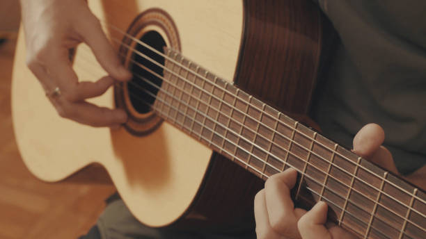 istock Hands of guitarist playing a guitar 645442740