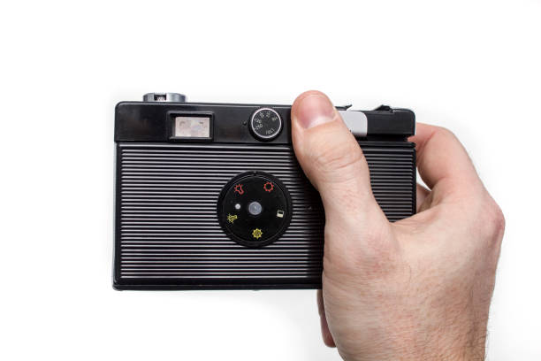 istock Old photo camera in a hand 645445684