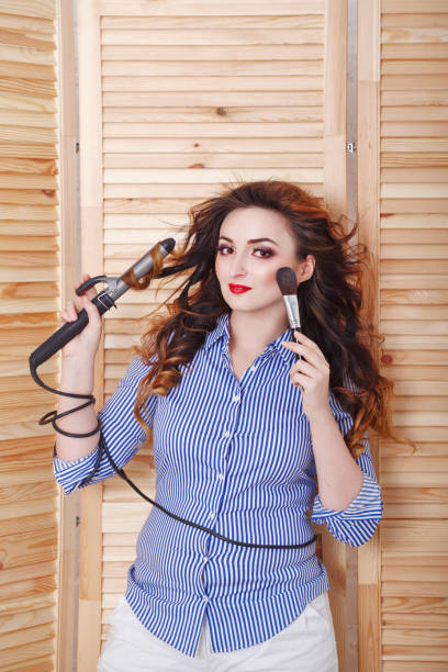 istock Girl doing morning makeup. 645445750