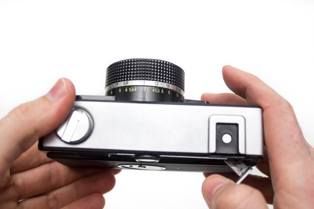 istock Old photo camera in a hand 645445842
