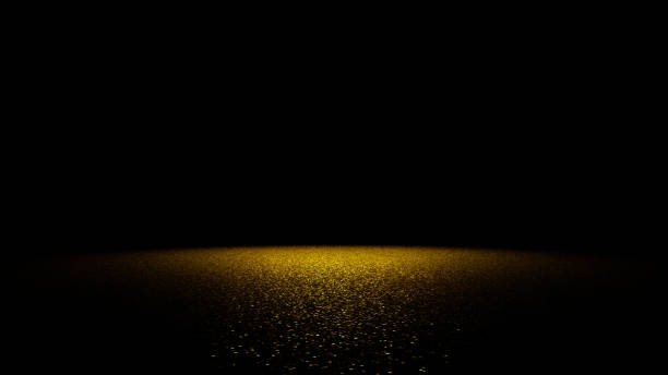 istock golden glitter on a flat surface lit by a bright spotlight 645448998