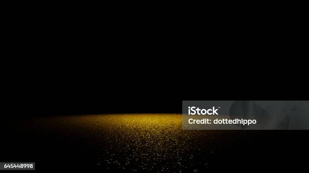 Golden Glitter On A Flat Surface Lit By A Bright Spotlight Stock Photo - Download Image Now