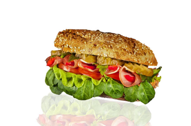 istock sandwich with ham, pickles, lettuce and tomato on a white background 645455336