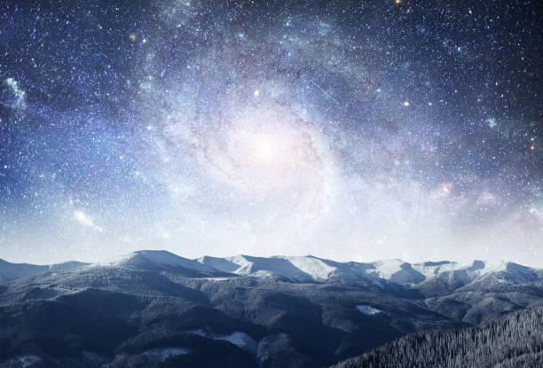 istock fantastic winter meteor shower and the snow-capped mountains. Dr 645462642