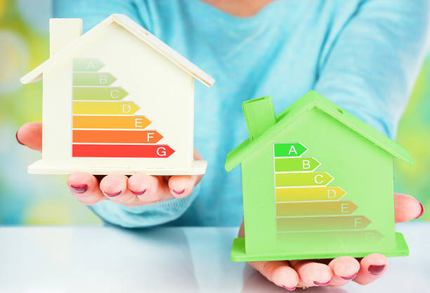 istock concept comparison between normal house and low consumption house with energy efficiency rating 645462796