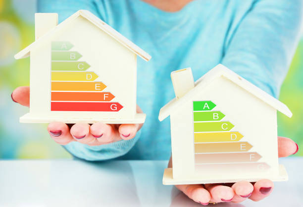 istock concept comparison between normal house and low consumption house with energy efficiency rating 645462824