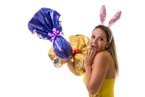 photo of blackboard with chalk drawing of smiling easter bunny on bicycle and magnetic letters that write happy easter