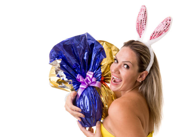 fun brazilian woman with easter egg in beige colors. holiday, easter, celebration concept.