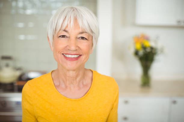 istock Happy senior woman in kitchen 645465552
