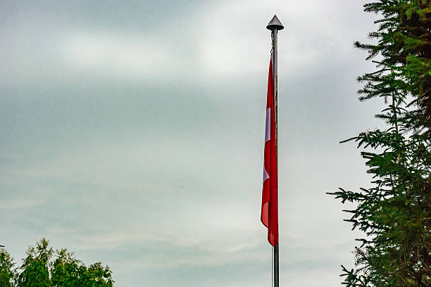 istock Low Angle View Of Swiss Flag Against Sky 645468281