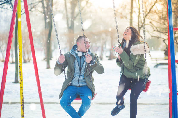 istock Beautiful young couple on the swing 645488944