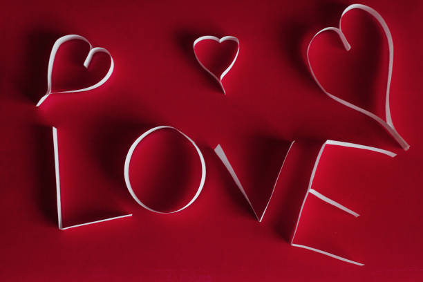 istock Valentine's day abstract background with cut paper heart 645496566