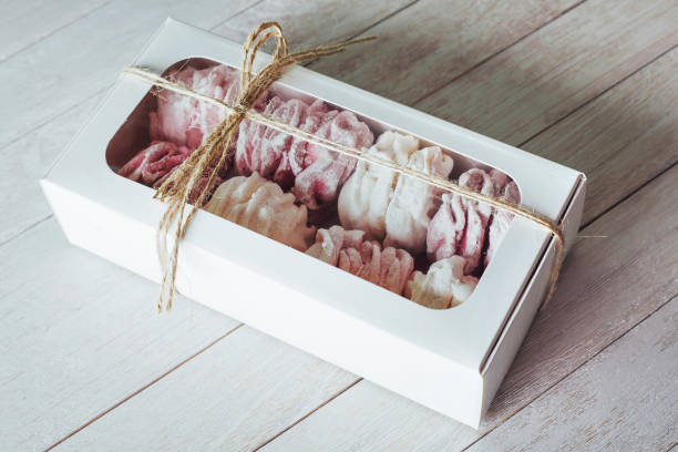 istock marshmallow in a box on  white wooden background 645498828