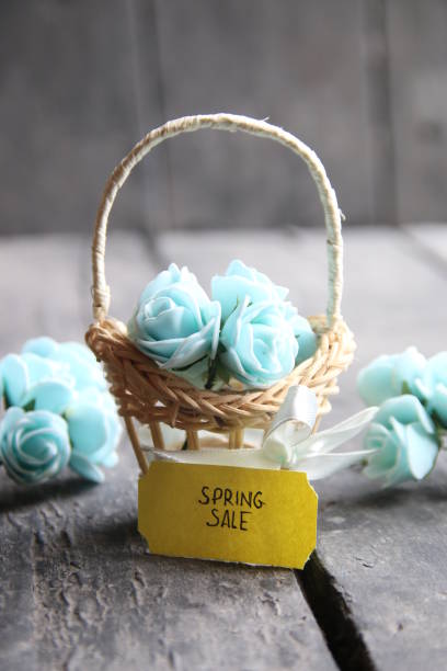 istock spring sale tag and flowers in a small basket 645505602