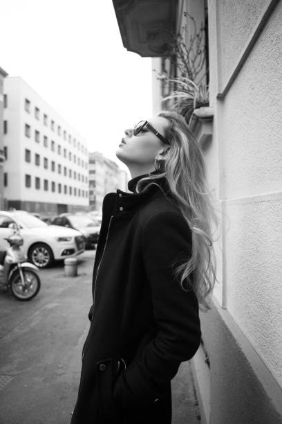 istock beautiful model with black long coat 645505710