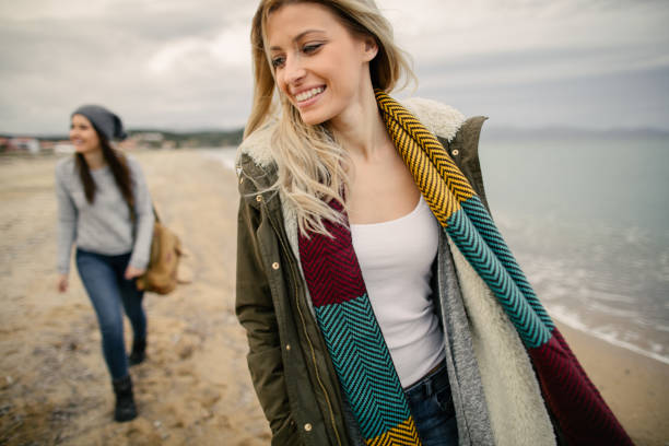 Group of friends strolling on the beach