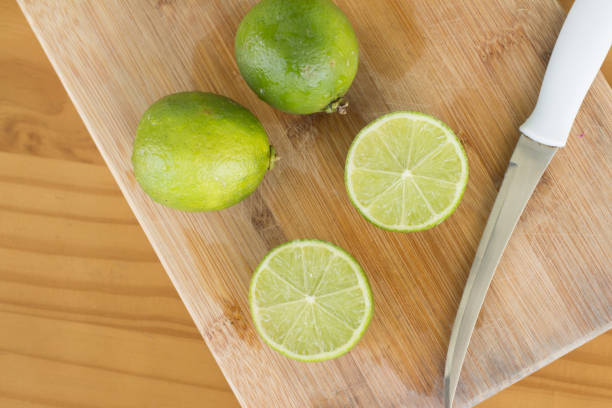 Sliced Tahiti Lemon over a woden board