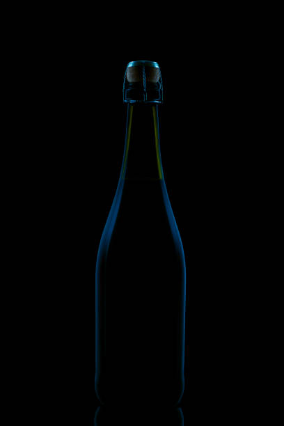 Bottle of champagne on black background. Silhouette of a bottle of sparkling wine.