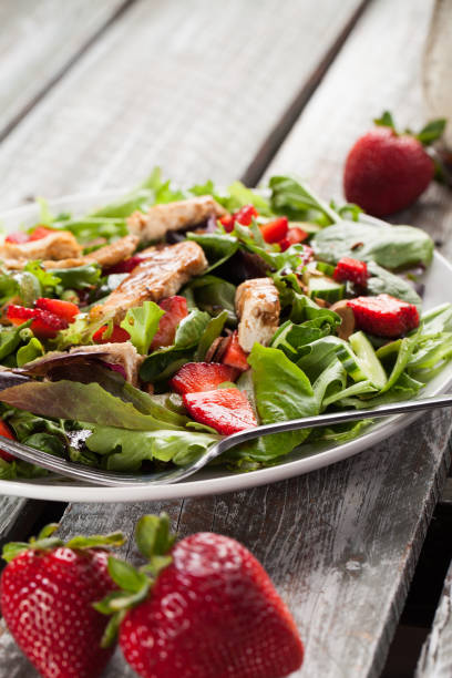 istock Strawberry Orange Honey Balsamic Salad weathered barn table 645527972
