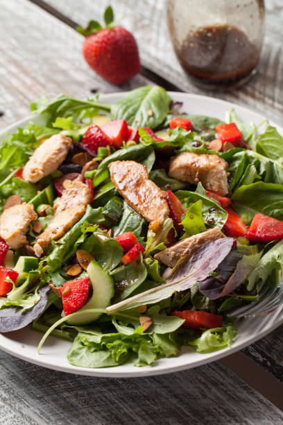 istock Strawberry Orange Honey Balsamic Salad old wood table 645528146