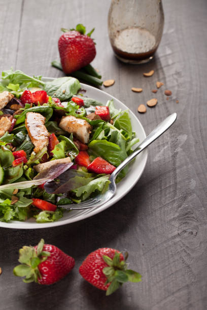 istock Strawberry Orange Honey Balsamic Salad with dressing 645528188
