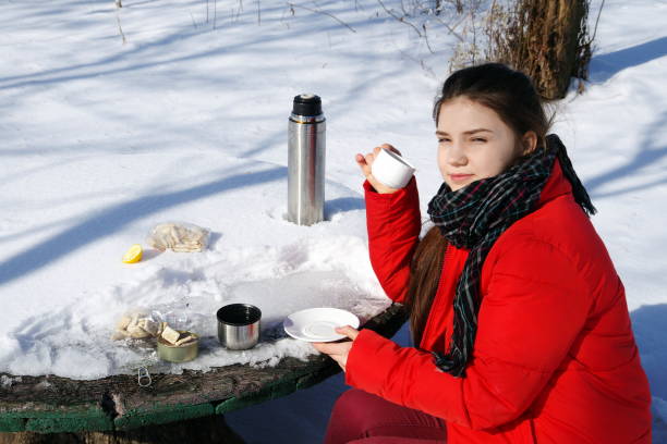 istock Young girl is resting while traveling on a winter landscape. 645531484