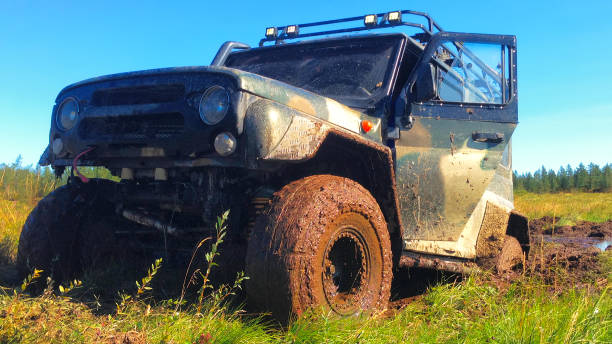 istock Off road vehicle coming out of a mud hole hazard 645532004