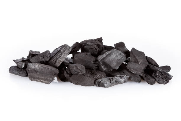 istock Pile of charcoal isolated on white 645537694