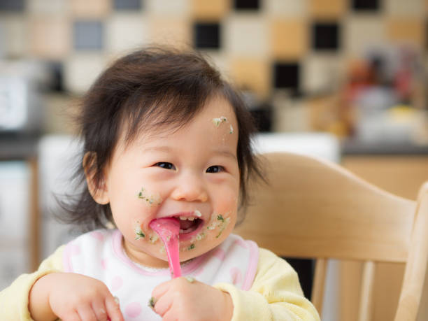 istock eating mess baby girl 645542946