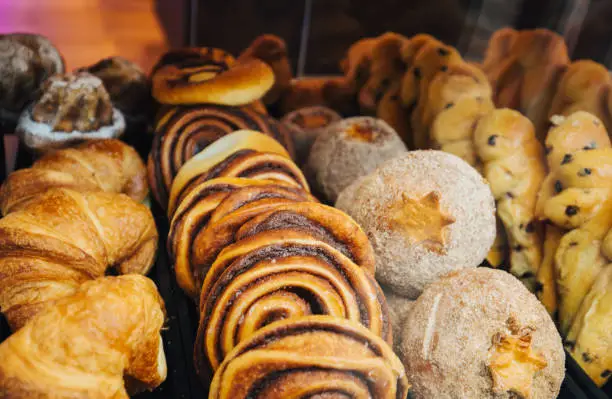 A variety of cakes and pastries on a boulangerie or patisserie market stall.