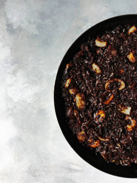 istock Black Rice Paella in Paellera Pan Top View 645543066