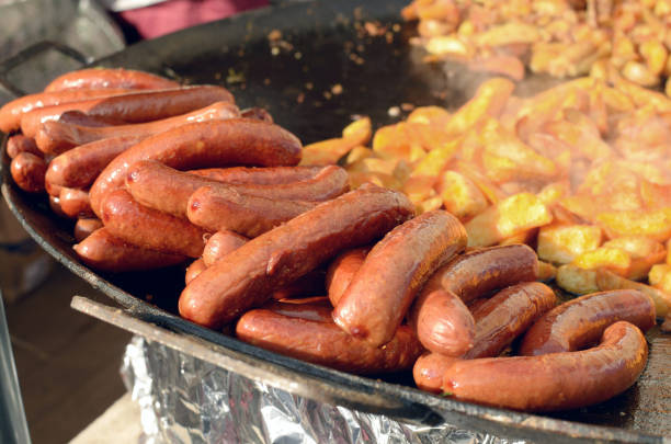 istock Fried sausages on a frying pan. 645543696