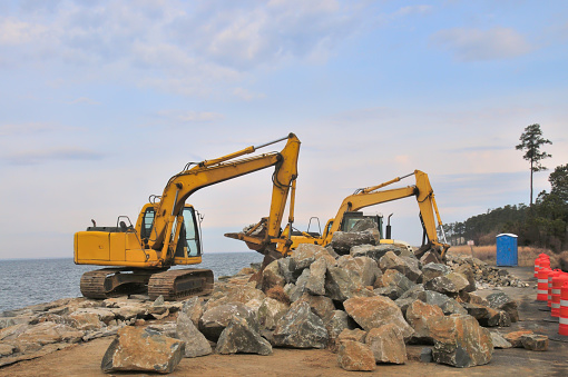 A construction site rebuilding the breakwater along the Chesapeake Bay on Maryland's Eastern Shore bring much needed blue collar jobs to the area on infrastructure spending by the state. And who says climate change is all bad?