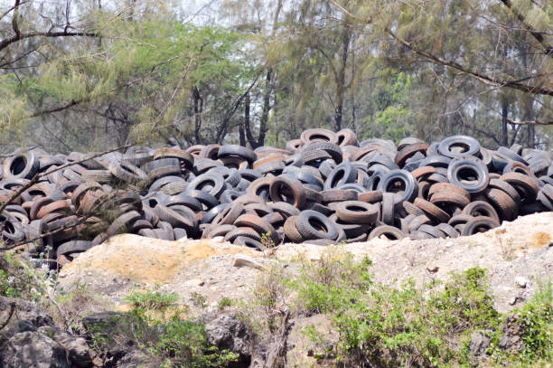 Used pile tires in nature ne Used pile tires in nature near Mombasa in Kenya afryka stock pictures, royalty-free photos & images