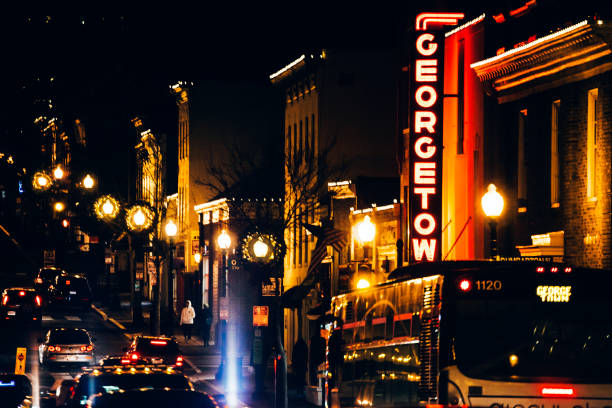 Washington, DC, USA - December 31, 2016: Night traffic in streets of Georgetown shopping and entertainment district.