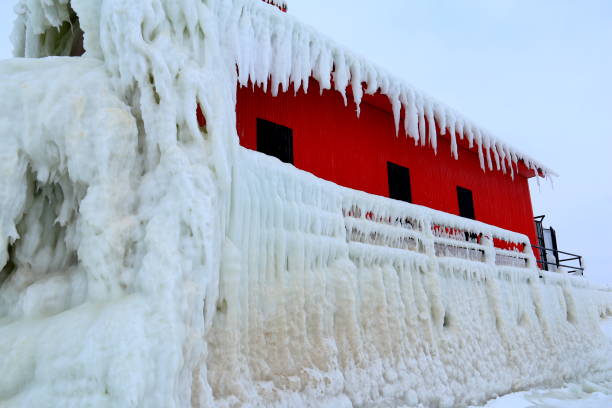 istock Frozen lighthouse with railing at Lake Michigan 645555106