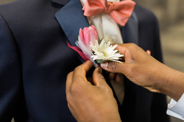 istock Pinning boutonniere to lapel 645557870