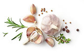 garlic and herbs isolated on white
