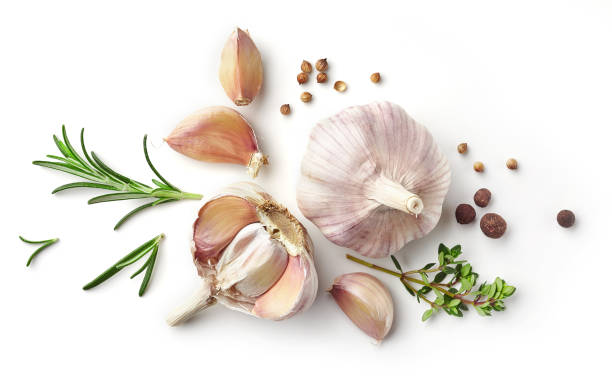 garlic and herbs isolated on white garlic and herbs isolated on white background, top view garlic stock pictures, royalty-free photos & images