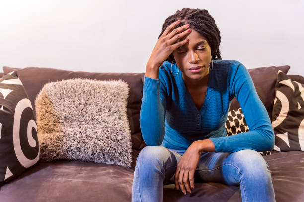 istock Depressed Asian girl  holding her head 645561452