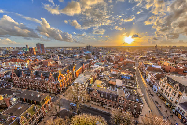 Helicopter View over historic part of Groningen city under setting sun