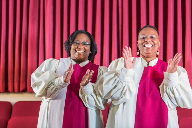 istock Two black women singing in church choir 645581484