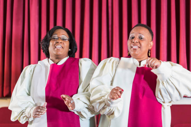 istock Two black women singing in church choir 645583496