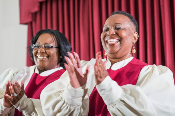 istock Two black women singing in church choir 645583626
