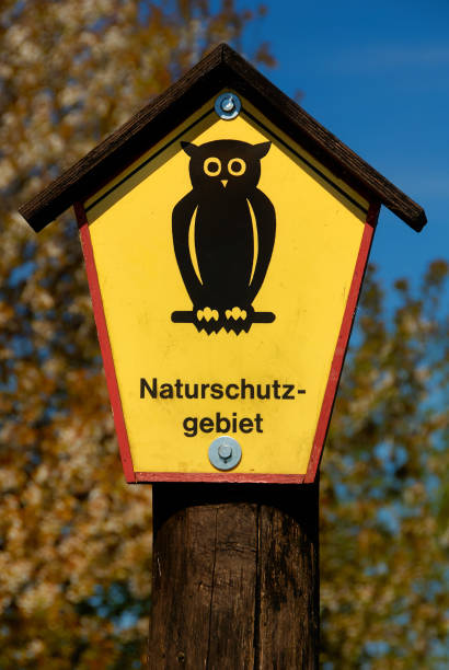 Zarrentin am Schaalsee, Germany - August 1, 2022: Nature park sign with owl allong the former internal border West and East Germany in biosphere nature park Schaalsee
