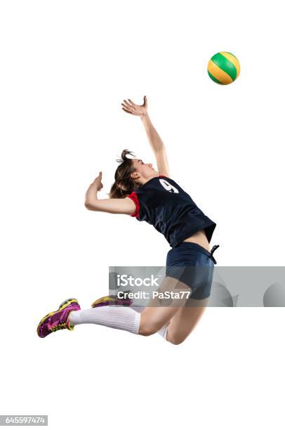 Female Volleyball Player Hitting The Ball Stock Photo - Download Image Now - Volleyball - Ball, Volleyball - Sport, Spiking