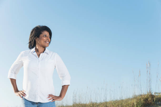 Confidence mature black woman, hands on hips