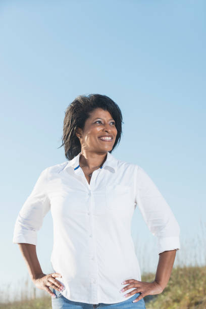 istock Confidence mature black woman, hands on hips 645598044