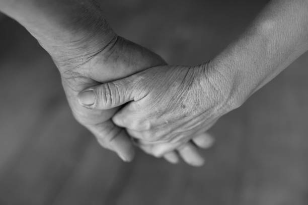 istock Senior married couple holding hands 645600766