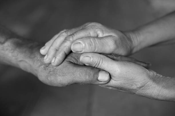 istock Senior married couple holding hands 645600830